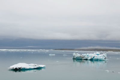 Scenic view of sea against sky during winter