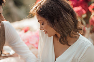 Portrait of woman with arms raised