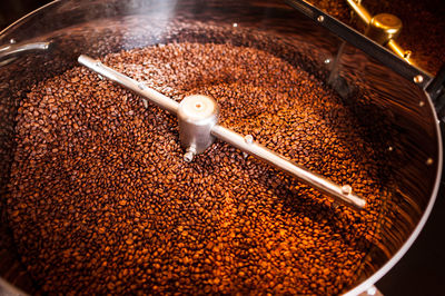 High angle view coffee beans in coffee grinder