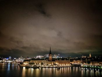 Illuminated city at waterfront