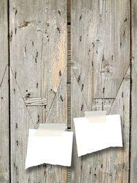 Directly above shot of paper hanging on wood