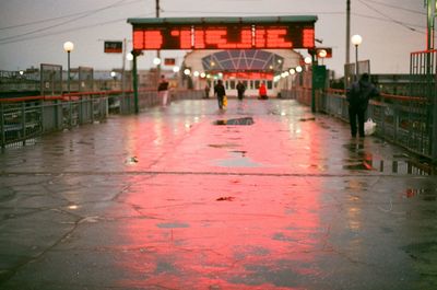 People on wet street during monsoon