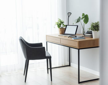 Office workplace with laptop on wooden table