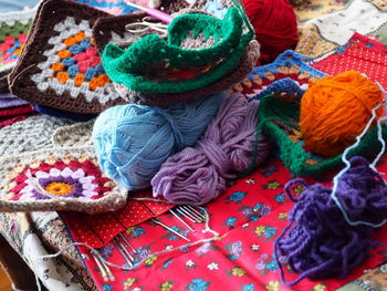 Close-up of knitting equipment on table