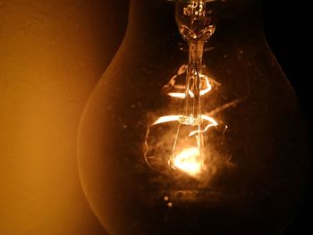 Close-up of illuminated light bulb