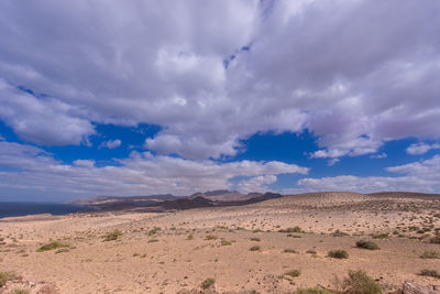 Scenic view of desert against sky