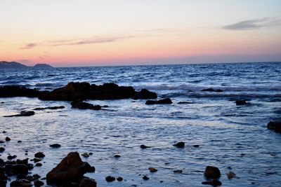 Scenic view of sea against sky at sunset