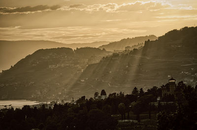 Scenic view of mountains against sky at sunset