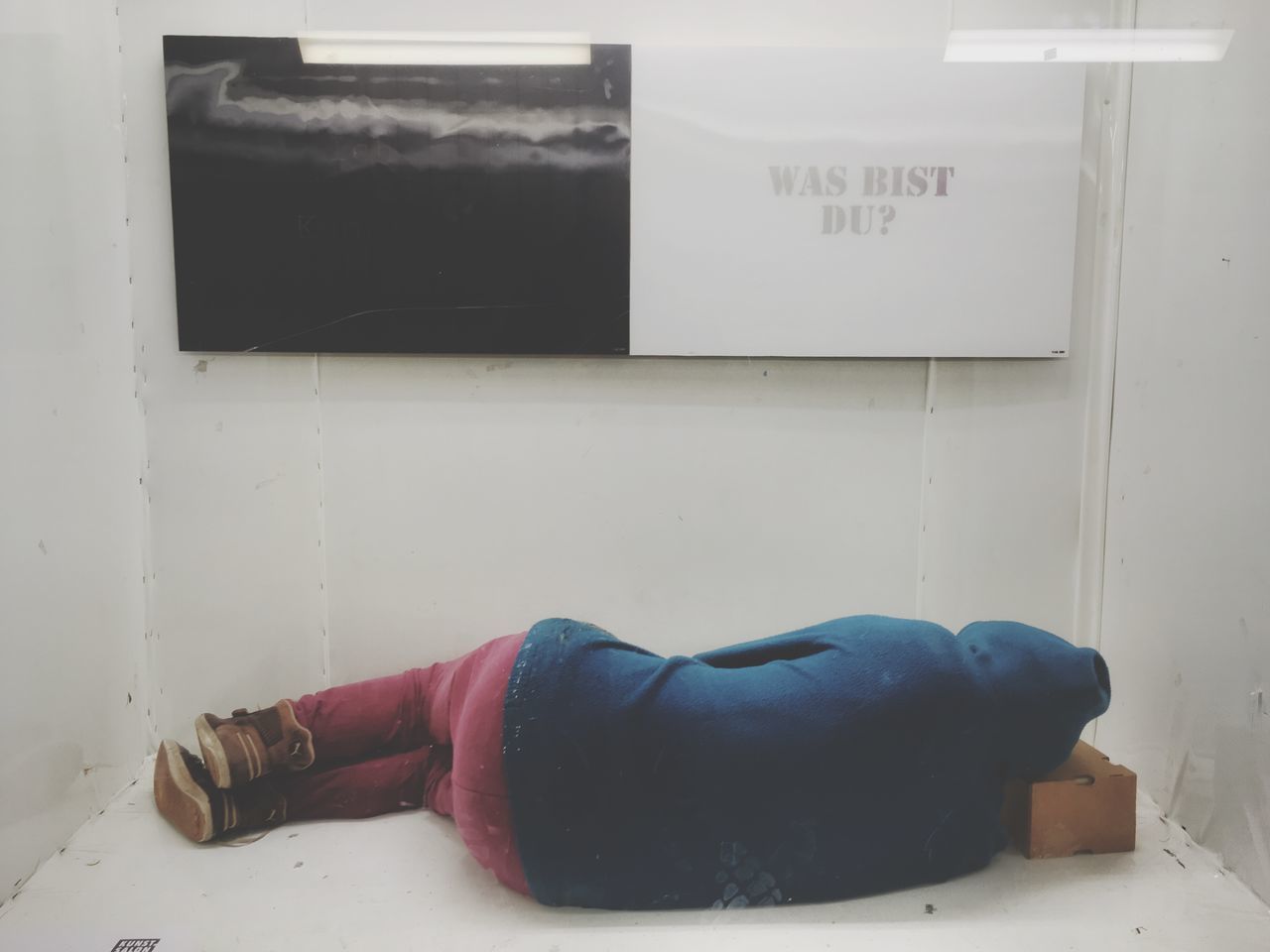 PERSON LYING ON WALL