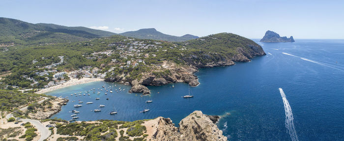 High angle view of sea against clear blue sky