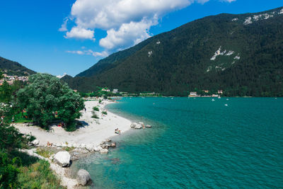 Scenic view of molveno lake and mountains against sky