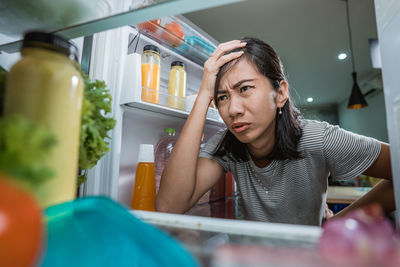 Mid adult woman looking at home