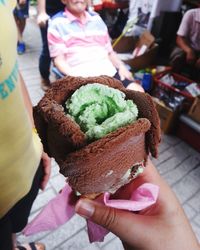 Close-up of woman holding ice cream