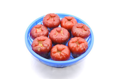 Close-up of fruit over white background