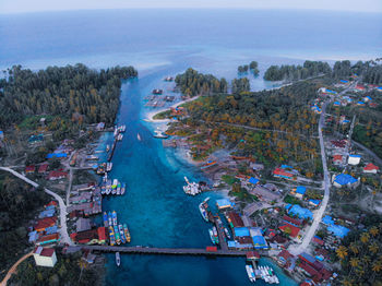 High angle view of trees and buildings against sky