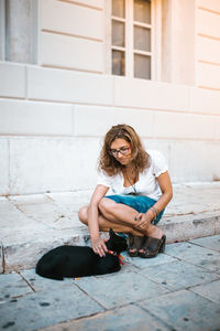 Portrait of young woman sitting outdoors