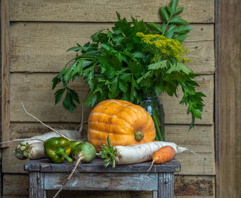 Farm harvest. yellow pumpkin, carrots, peppers and celery