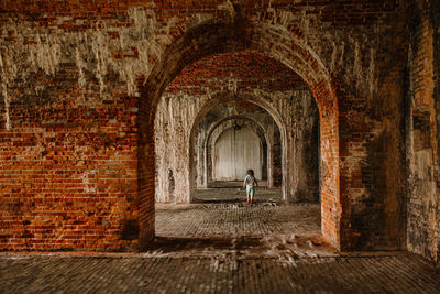 Man standing in old building