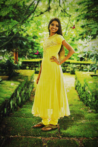 Portrait of young woman standing outdoors