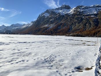 Scenic view of snowcapped mountains against sky