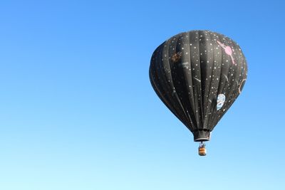 Hot air balloon against clear blue sky