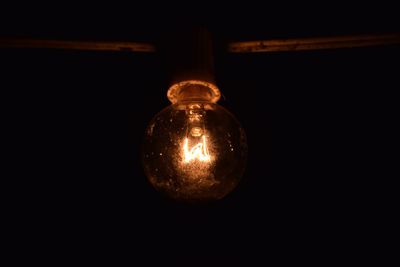 Low angle view of illuminated light bulb