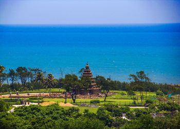 Panoramic view of temple and building against blue sky