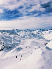 Scenic view of snowcapped mountains against sky