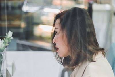 Close-up of woman looking away