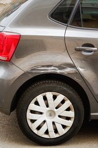 Close-up of car on road