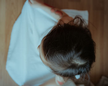 High angle view of boy sleeping on bed at home