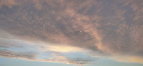 Low angle view of dramatic sky during sunset