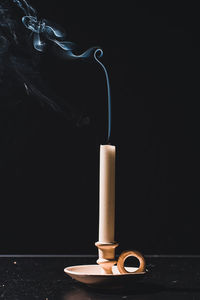 Close-up of cigarette against black background