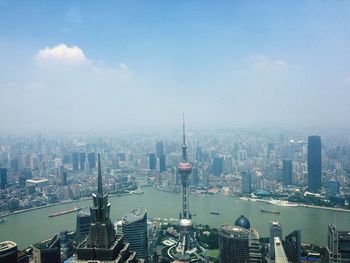 High angle view of huangpu river amidst modern buildings in city