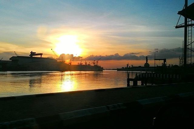 sunset, sun, water, orange color, nautical vessel, transportation, sky, mode of transport, sea, silhouette, boat, sunlight, built structure, sunbeam, architecture, reflection, cloud - sky, scenics, building exterior, beauty in nature