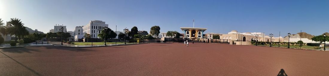 Panoramic view of city buildings against clear sky