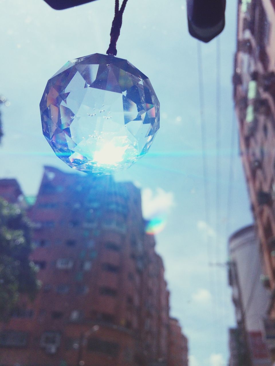 transparent, glass - material, focus on foreground, sphere, close-up, reflection, low angle view, indoors, drop, sky, bubble, lighting equipment, hanging, tree, window, glass, no people, day, water, mid-air