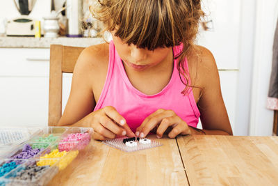 Girl playing with toys at home