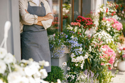 Rear view of woman holding flowers