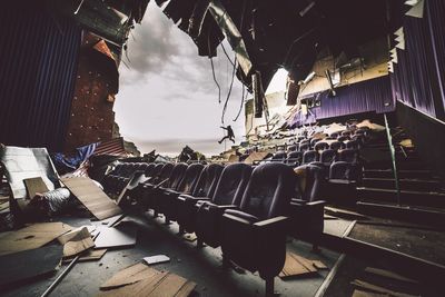 Man jumping in abandoned theater