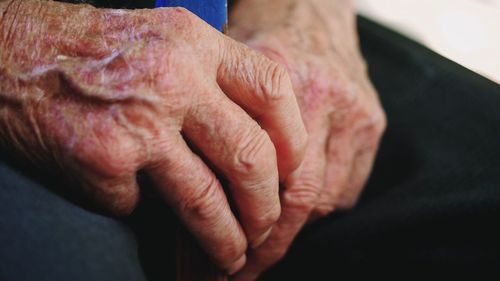 Cropped image of woman with wrinkled hands