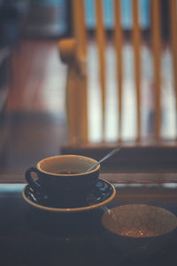 Close-up of coffee cup on table