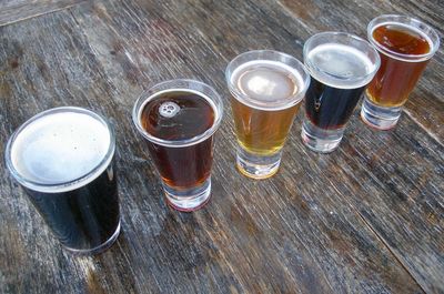 High angle view of beer glasses on table