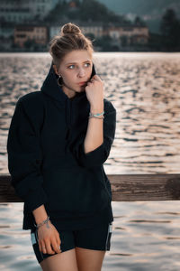 Portrait of beautiful woman standing in water