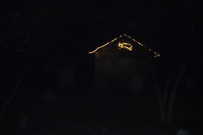 Low angle view of illuminated building at night