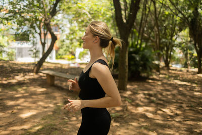 Woman running and jogging at a park outdoors. athlete female person during workout. healthy 