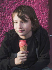 Portrait of woman holding ice cream