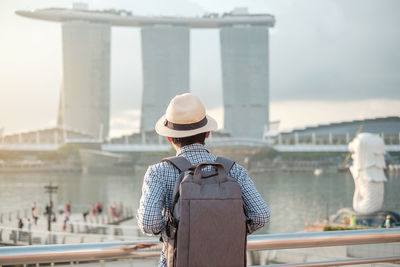 Rear view of man looking at city