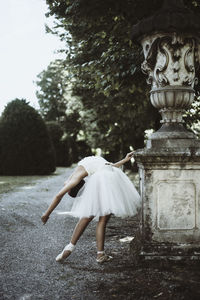 Ballet dancer dancing on road