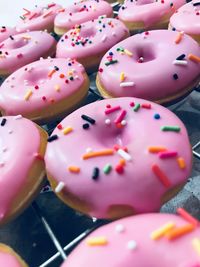 High angle view of donuts on cooling rack